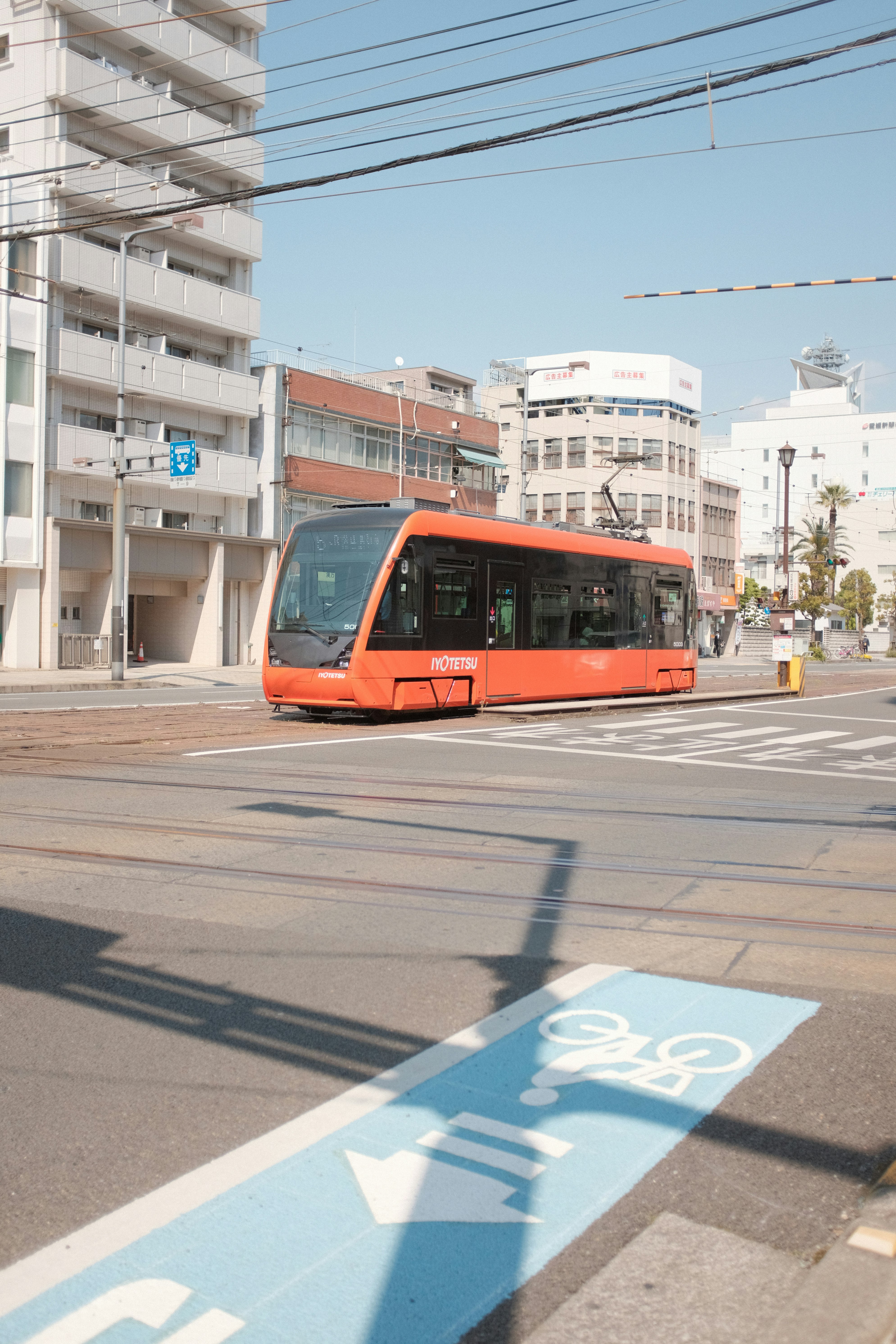 red and white tram on road during daytime